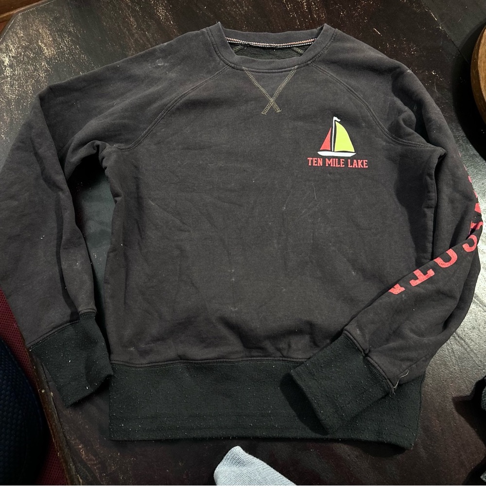 dark brown crewneck graphic boat sweatshirt with red accents